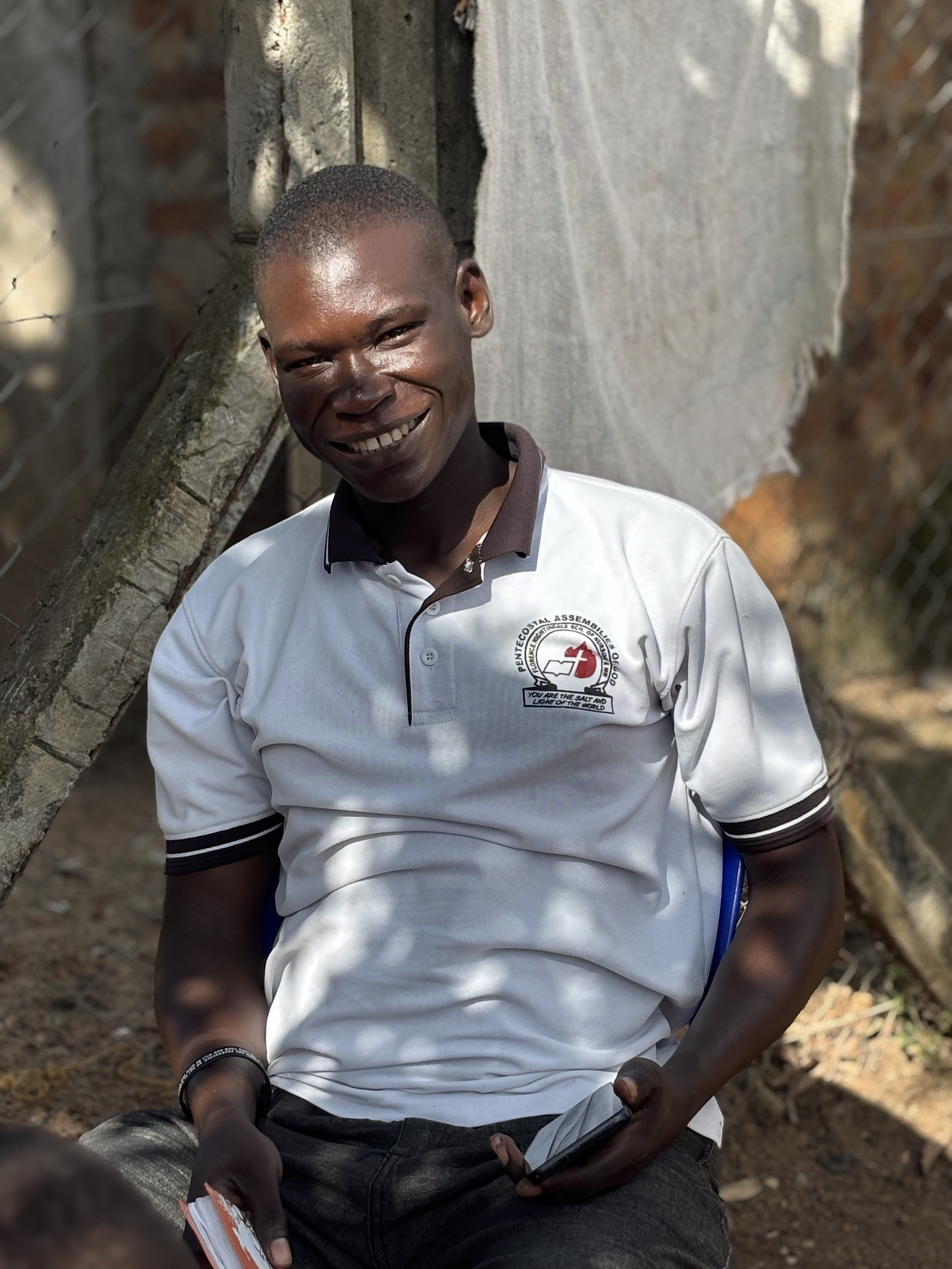 Olupot Moses, the first child cared for by Mark of Hope International, now serving as a nurse